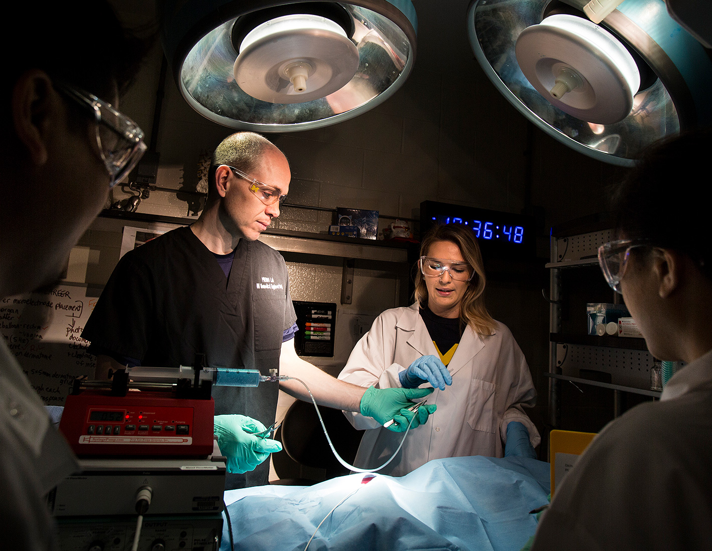 Three students experimenting